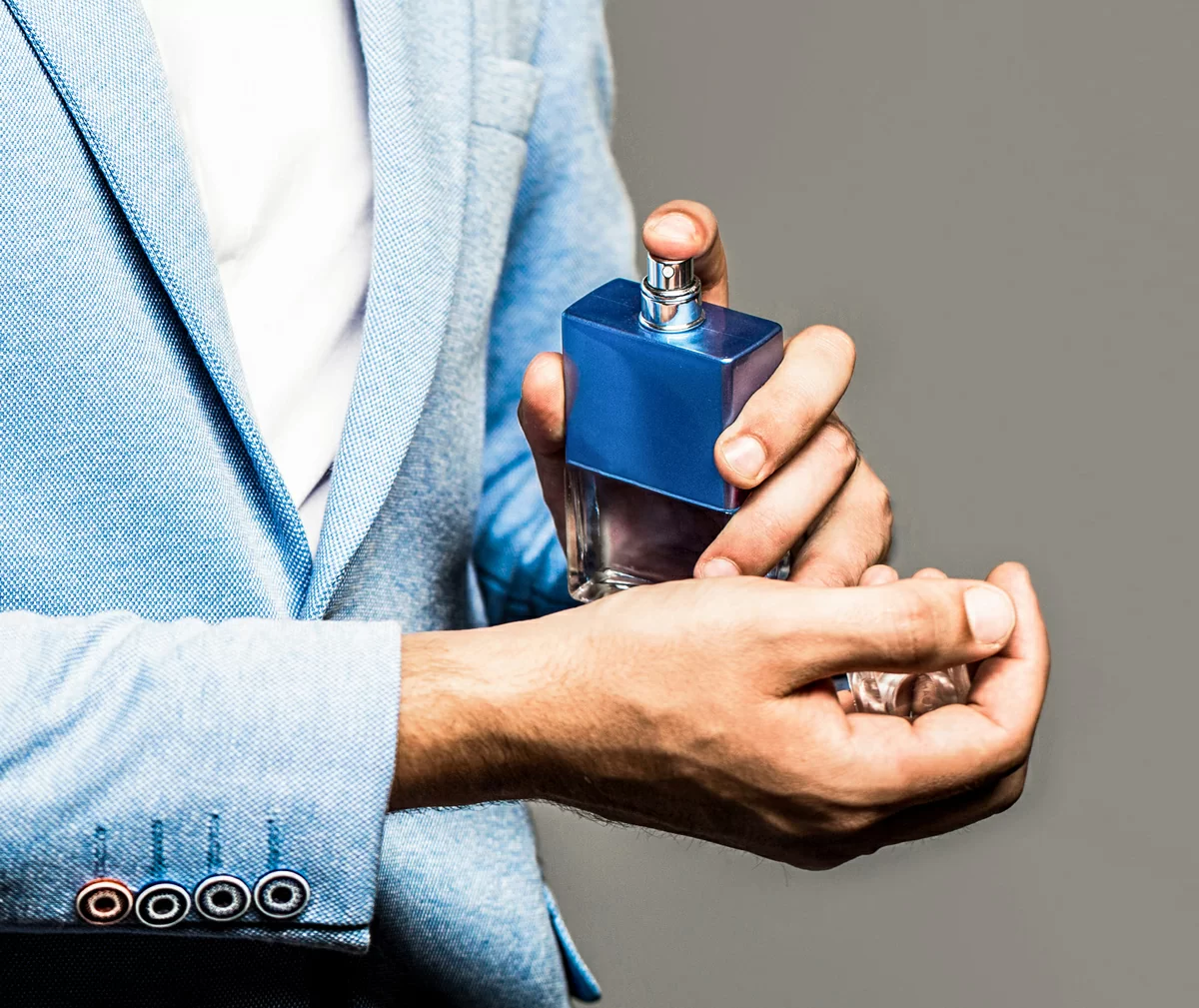 perfume-cologne-bottle-male-fragrance-perfumery-cosmetics-man-perfume-fragrance-masculine-perfume-man-holding-up-bottle-perfume.jpg